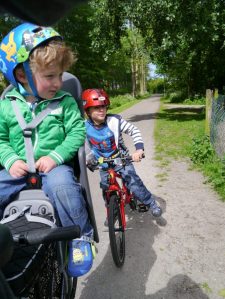 The boys on the bikes, looking at the animals