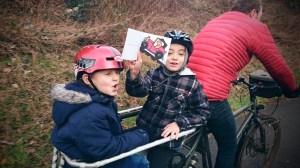 The boys reading on the back of the Big Dummy
