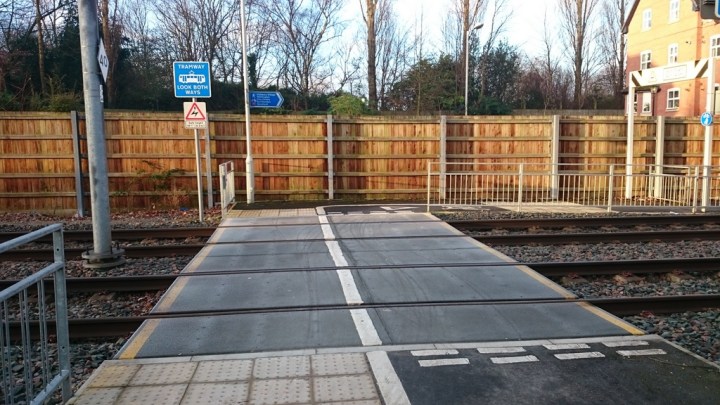 Crossing the Metrolink track at Didsbury Village