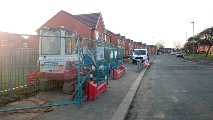 Construction vehicles blocking the pavement