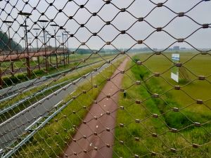 Looking down over the railway, road and cycleway