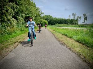 The boys riding along the cycle path in Vlietland