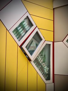 Quite a few bottles in the windows of a Cube House