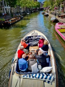 Fancy looking boat passing under the bridge