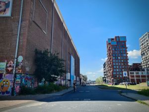 Side of the STRAAT Museum on the left, apartment blocks on the right