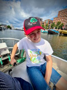 Youngest driving the boat