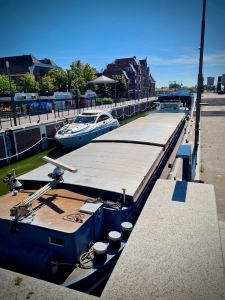 Big and small boats passing through the large Zaan locks