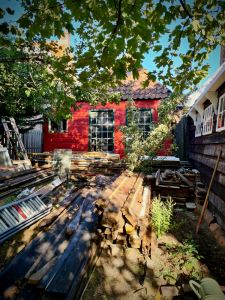 The barns at our Airbnb holiday home, wood from a barn on the ground, which is to be rebuilt