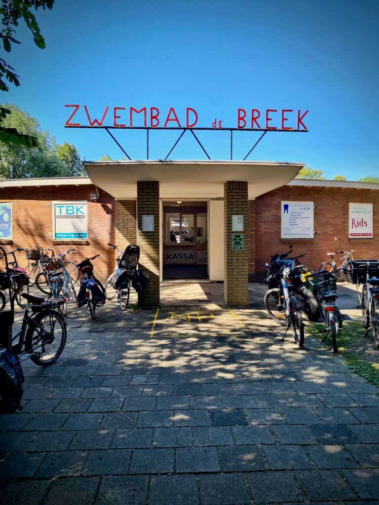 Lots of bikes parked up at Zwembad De Breek entrance
