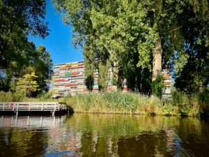 Apartment block with shades blocking out the late afternoon sun