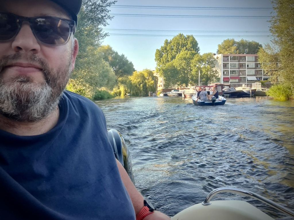Boat selfie as another boat passes