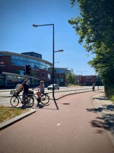 People waiting to cross Reinier de Graafweg