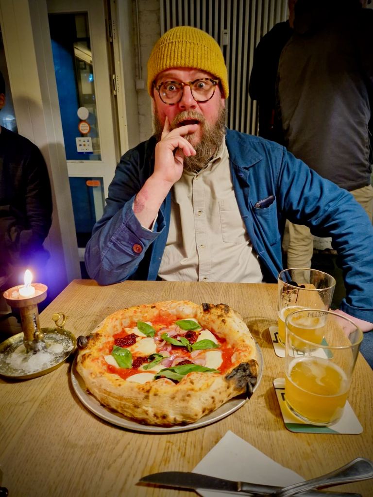 Enjoying pizza from Standard Pizza and beer at Mikkeller