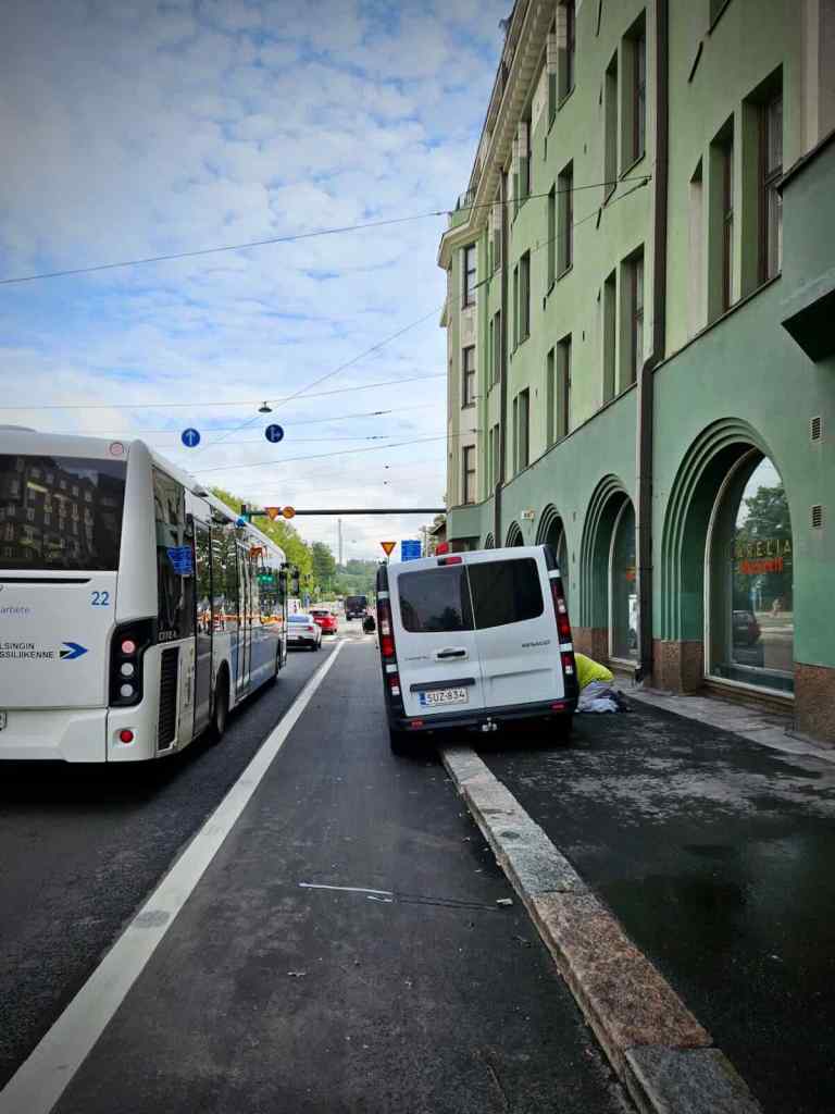 The all too familiar painted cycle lane and pavement-parked van