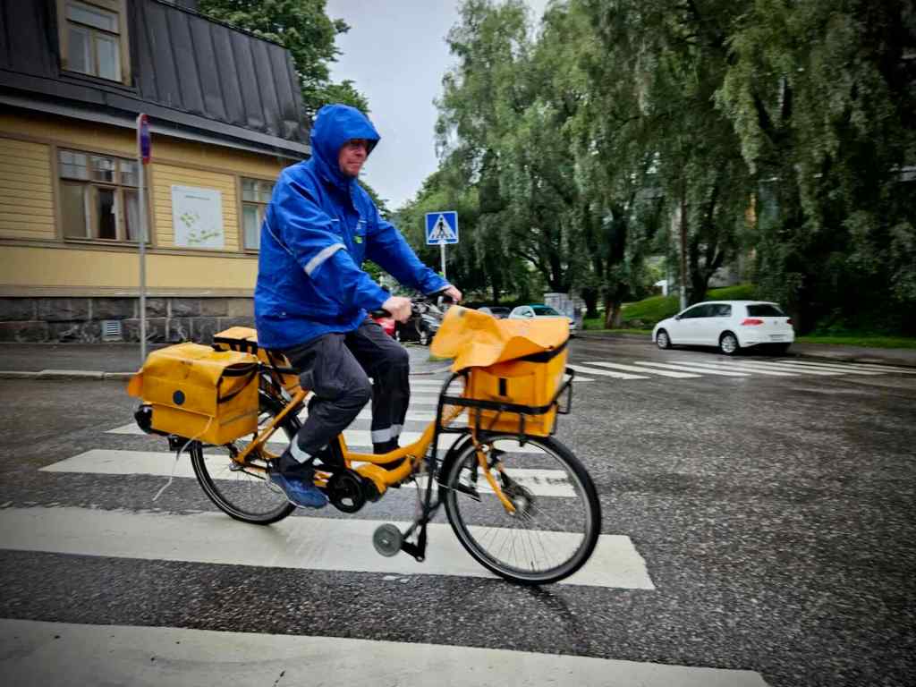 Postman on his cargo bike