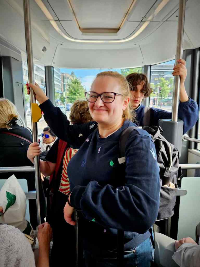 On the tram to Töölö with our luggage