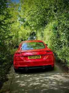 Cars blocking my way, as one reverses