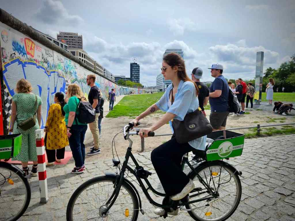 Cycling past the East Side Gallery
