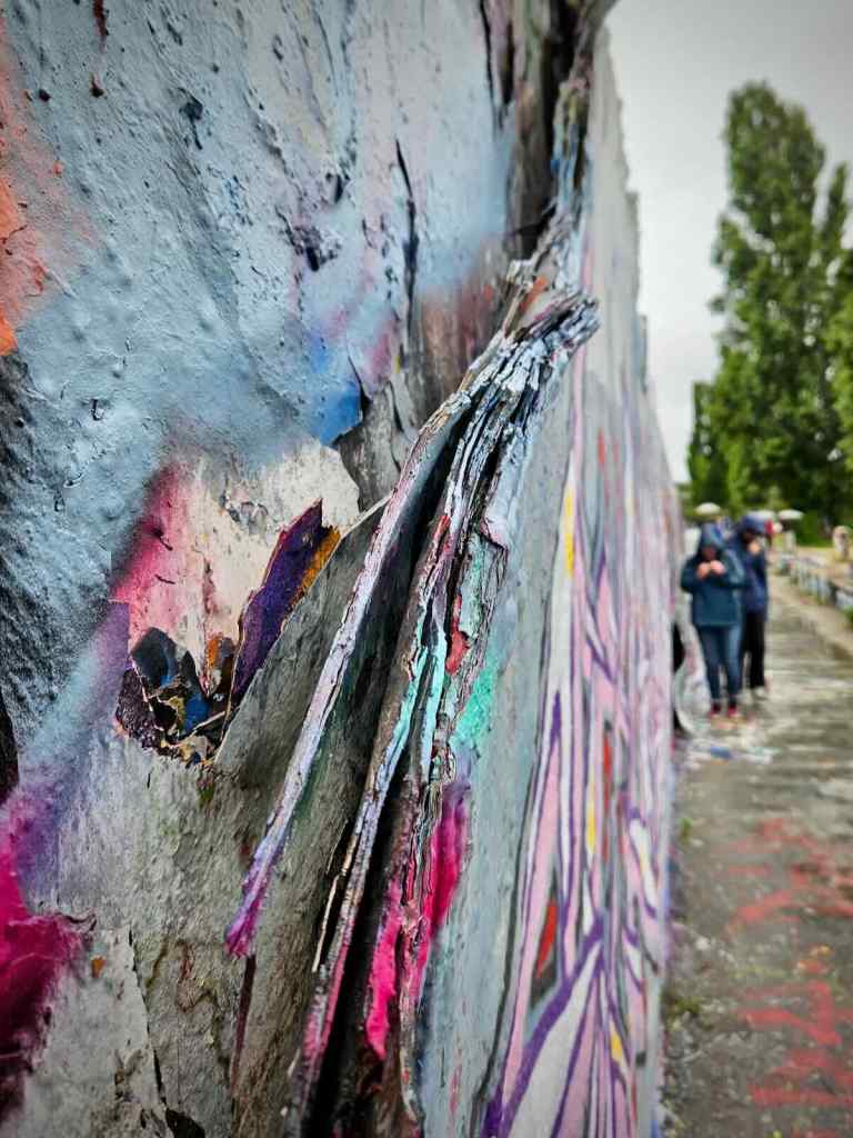 Many layers of paint on the old section of Berlin Wall that remains in the park