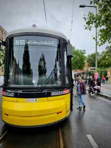 People boarding a tram on Bernauer Straße