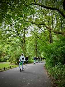 Group riding electric scooters in the Tiergarten