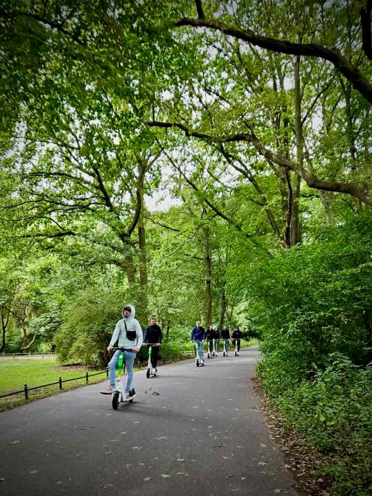 Group riding electric scooters in the Tiergarten