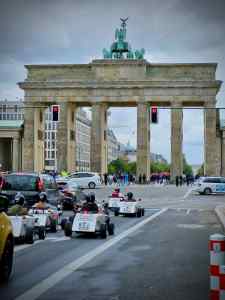 Mini hotrod tour in front of the Brandenburg Gate