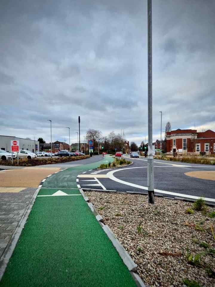 Approaching the car park entrance off the roundabout, priority for walking and cycling