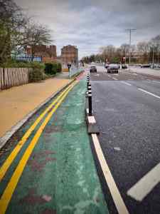 Narrow, wand protected section approaching the A56 junction