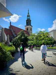 Riding across Alexanderplatz towards St. Marienkirche Church