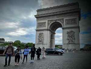 Brave people crossing the roundabout at Place Charles de Gaulle
