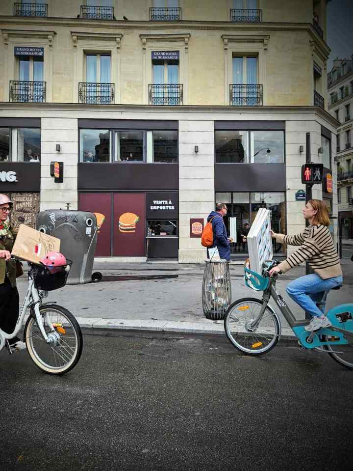 People carrying cargo on their bikes