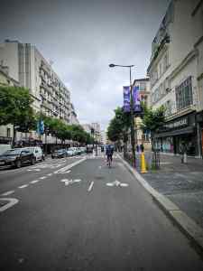 Wide bidirectional kerb-protected cycle lane on Rue Marx Dormoy