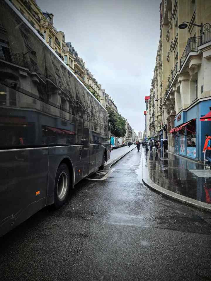 Coach getting a little too close for comfort, riding on the kerb protection on Rue Beaubourg