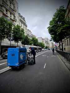 Wide bidirectional cycle lane on Rue Marx Dormoy with cargo bike unloading