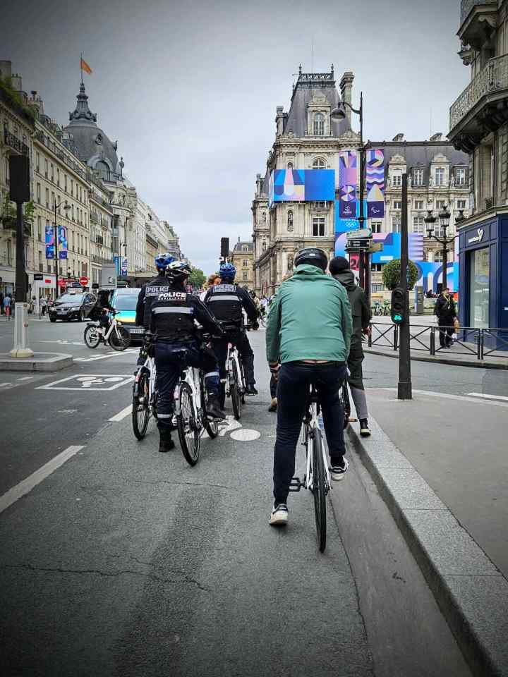 Police and others waiting at the lights on Rue de Rivoli