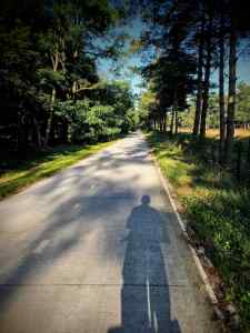 Long shadow on the concrete path on Monnikenboschweg