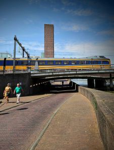 Train passing over the underpass and river