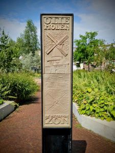 Commemorative plaque for Molen De Rijzende Zon windmill once located here
