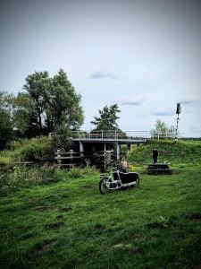 Urban Arrow cargo bike parked next to the canal