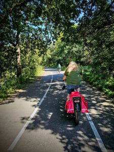 Riding on the path away from the beach