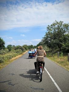 Riding along the path, back from the beach