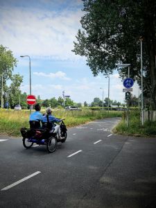 Side by side cycle passing by