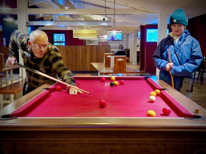 Playing pool in the Sports Café, looking like a seasoned professional! 😉
