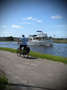 Boat passing a bike on the Vliet canal