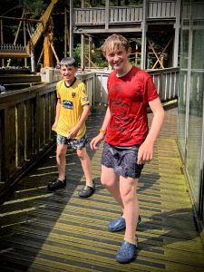 Soaked after waiting on the bridge over the Splash ride