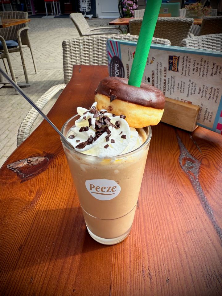 Iced coffee and a bonus doughnut at Pops