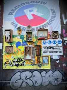 Some artworks on a old shop front on Botermarkt