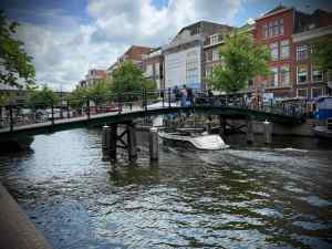 Boat passing under a bridge on Nieuwe Rijn
