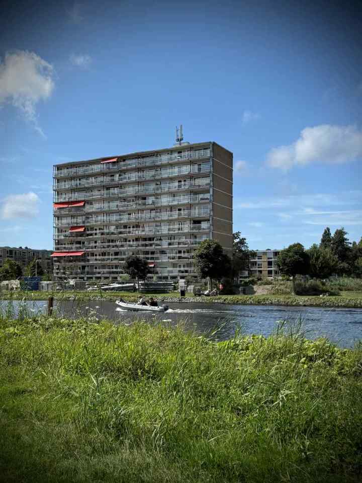 Boat and apartment block on the Vliet Canal